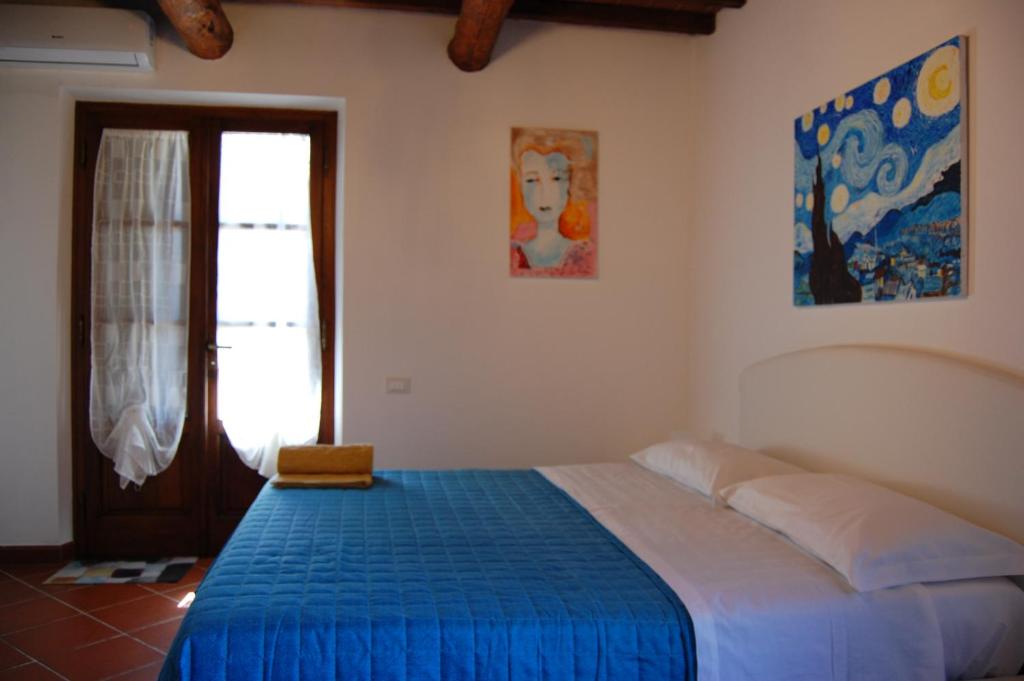 Postel nebo postele na pokoji v ubytování Casa VALGRAZIOSA