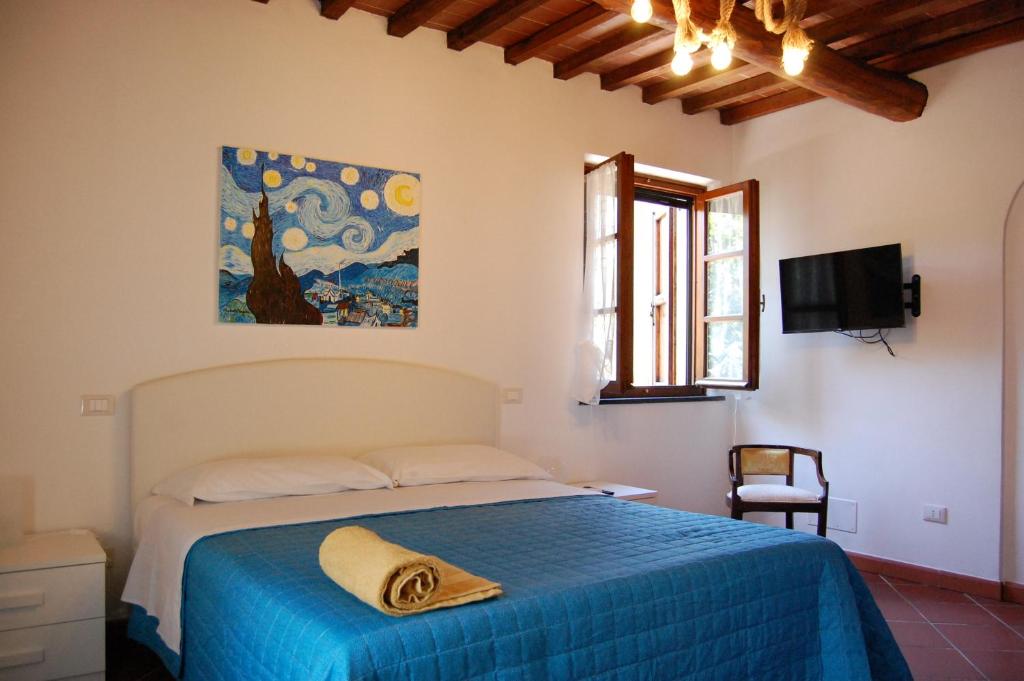 Postel nebo postele na pokoji v ubytování Casa VALGRAZIOSA