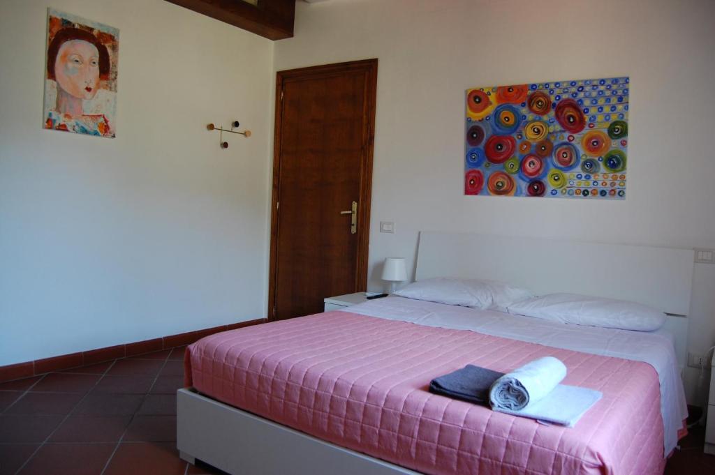 Postel nebo postele na pokoji v ubytování Casa VALGRAZIOSA