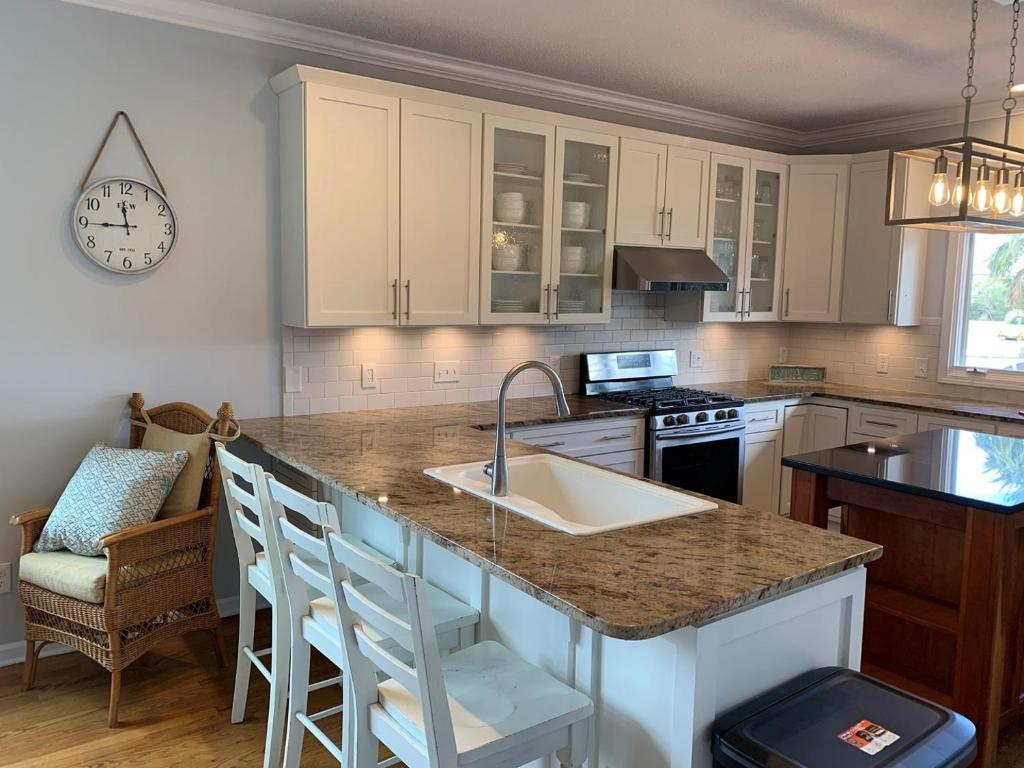 a kitchen with a sink and a counter top at Tortuga home in Holden Beach