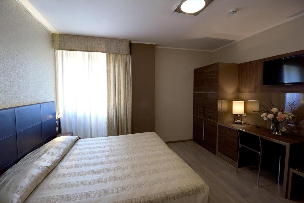 Postel nebo postele na pokoji v ubytování Hotel Park