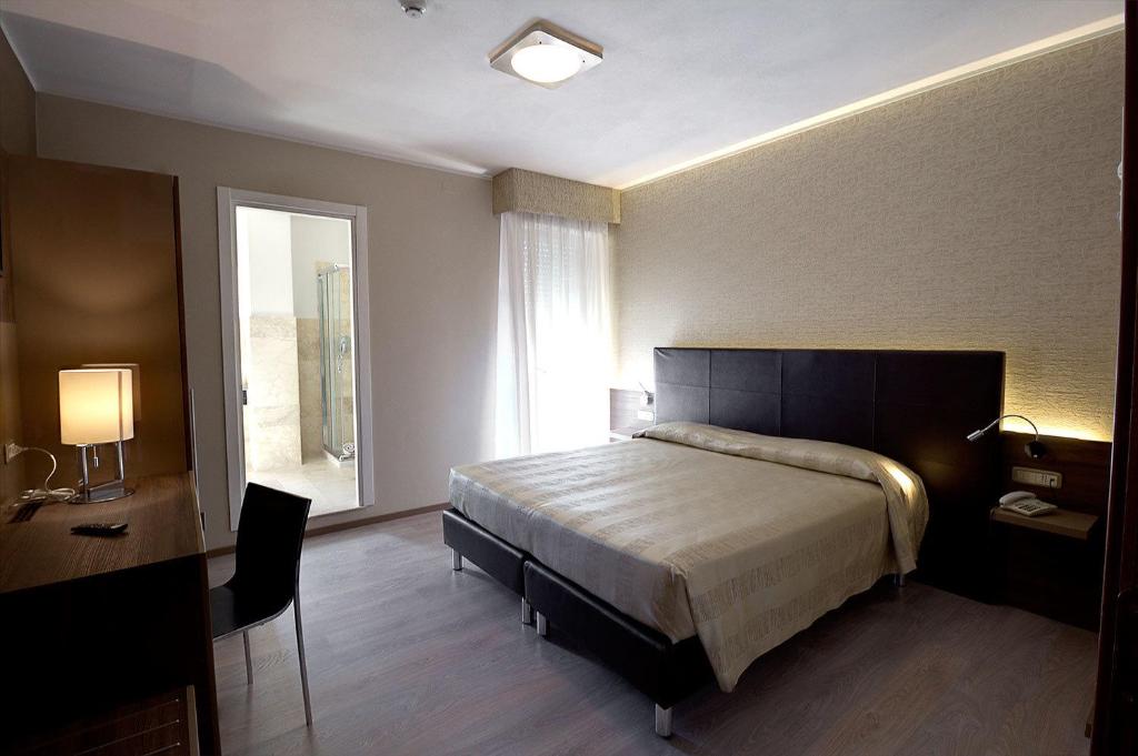 Postel nebo postele na pokoji v ubytování Hotel Park
