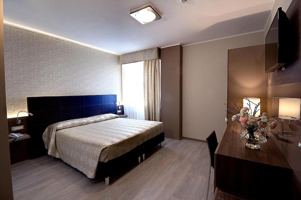 Postel nebo postele na pokoji v ubytování Hotel Park