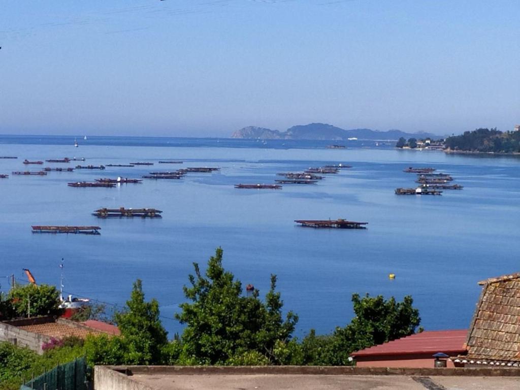 a view of a large body of water with boats in it at Vista a las Cíes in Moaña