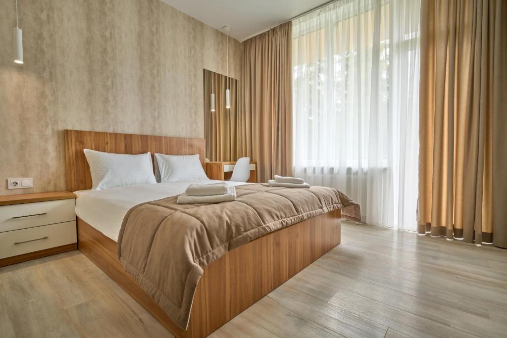 Postel nebo postele na pokoji v ubytování Готель У Борисовича & SPA