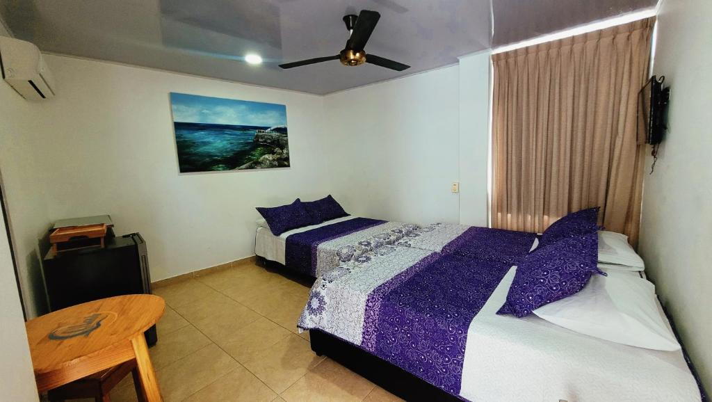 Postel nebo postele na pokoji v ubytování Hotel Olas