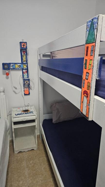 Postel nebo postele na pokoji v ubytování Beach House Lanzarote