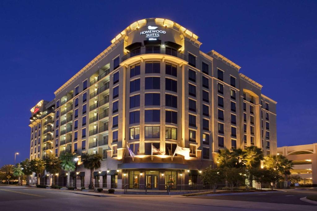 a large white building with a sign on top of it at Homewood Suites by Hilton Jacksonville-Downtown/Southbank in Jacksonville