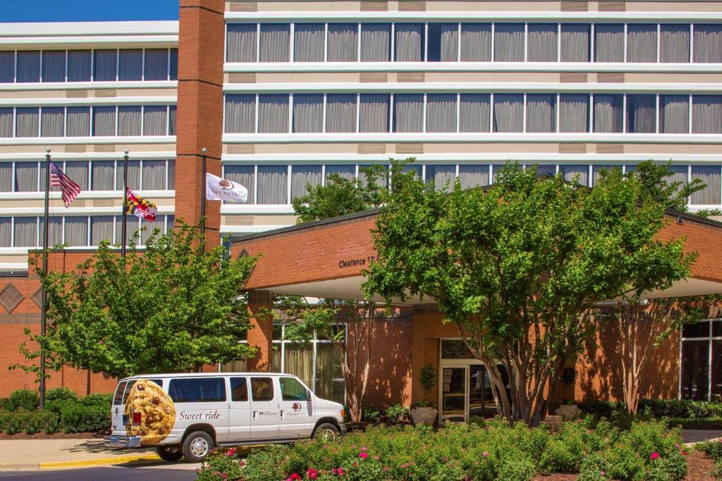 a white van parked in front of a building at DoubleTree by Hilton Hotel Largo Washington DC in Largo