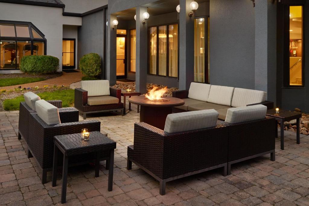 a patio with couches and chairs and a fire pit at Courtyard by Marriott Nashville Brentwood in Brentwood