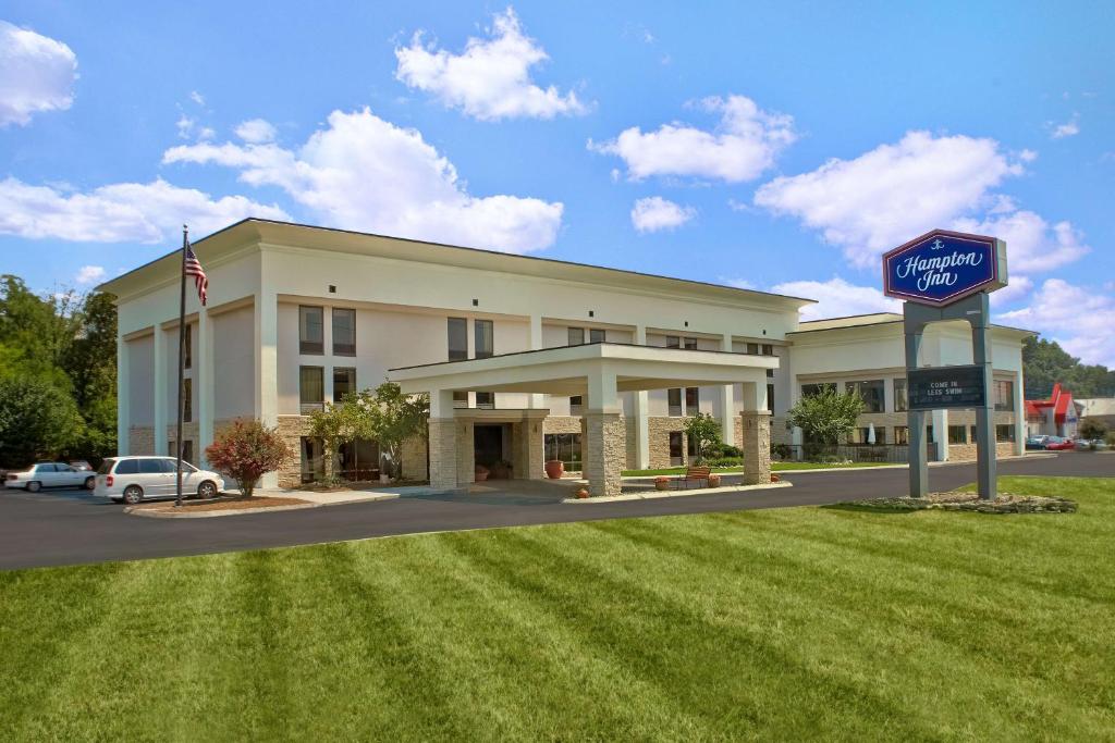 a large building with a sign in front of it at Hampton Inn Sevierville in Sevierville