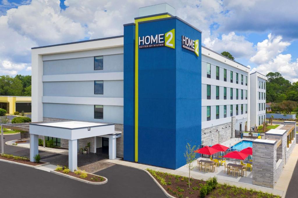 a rendering of a home depot hotel with a ping pong table outside at Home2 Suites By Hilton Columbia Southeast Fort Jackson in Columbia