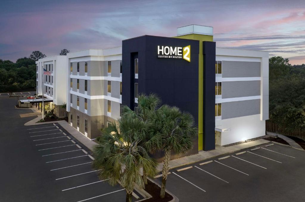 a building with a home improvements sign on it at Home2 Suites by Hilton Charleston Airport Convention Center, SC in Charleston