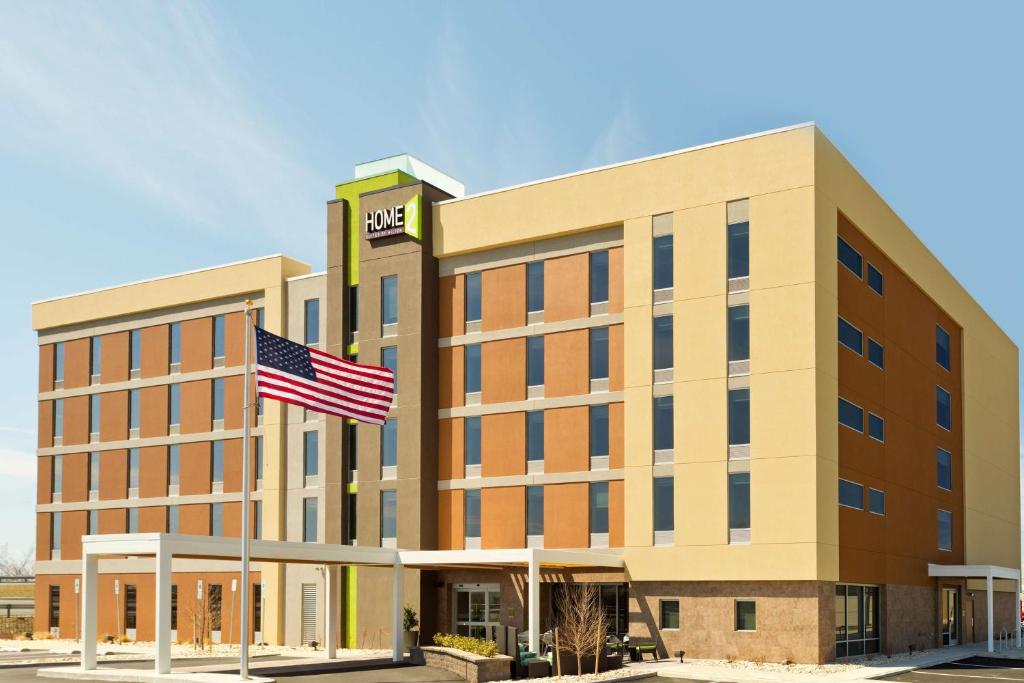 an image of an office building with an american flag at Home2 Suites by Hilton Baltimore/Aberdeen MD in Aberdeen