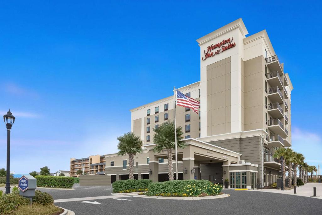 a rendering of the exterior of a hotel at Hampton Inn & Suites by Hilton Carolina Beach Oceanfront in Carolina Beach
