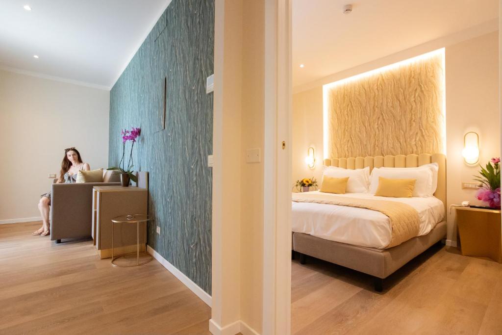 Postel nebo postele na pokoji v ubytování Hotel Helios