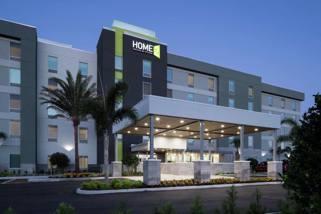 an image of the front of a hotel at Home2 Suites By Hilton Orlando Airport in Orlando