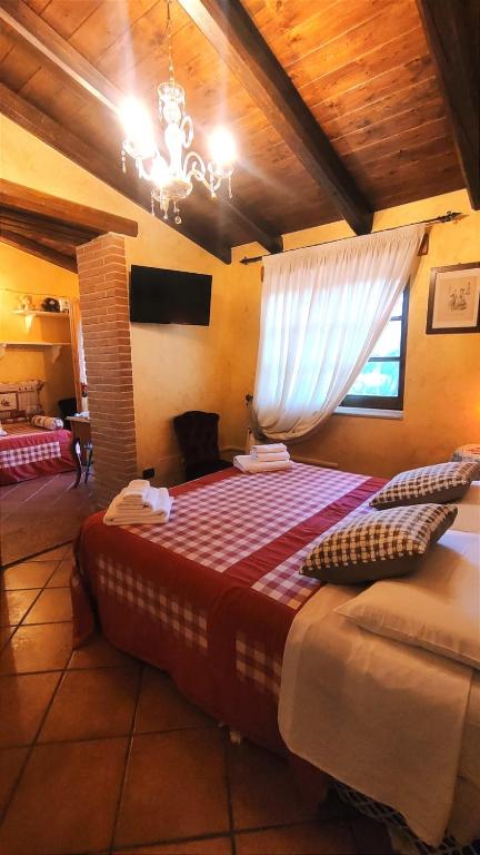 Postel nebo postele na pokoji v ubytování L'antica quercia