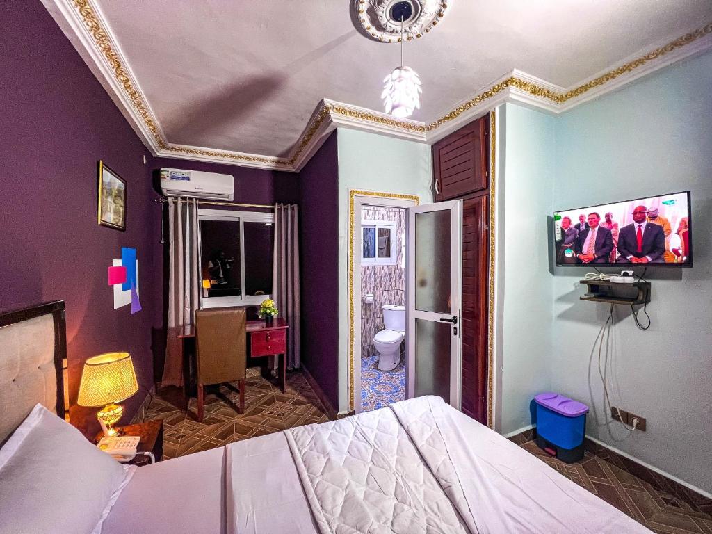 Postel nebo postele na pokoji v ubytování Hôtel The Place
