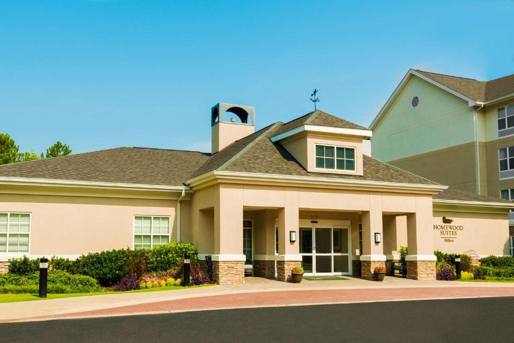 a large house with a building at Homewood Suites by Hilton Birmingham South Inverness in Hoover