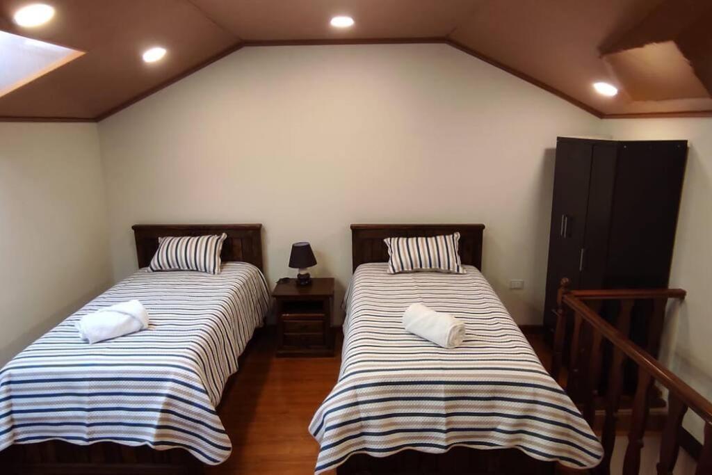 Casa Ayacucho tesisinde bir odada yatak veya yataklar
