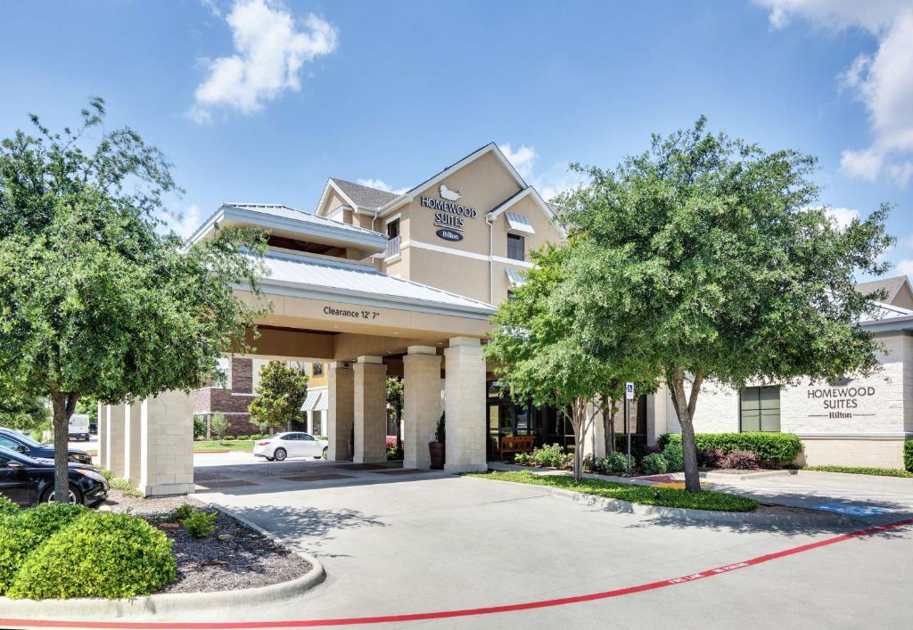 a building with trees in front of it at Homewood Suites by Hilton Dallas/Allen in Allen