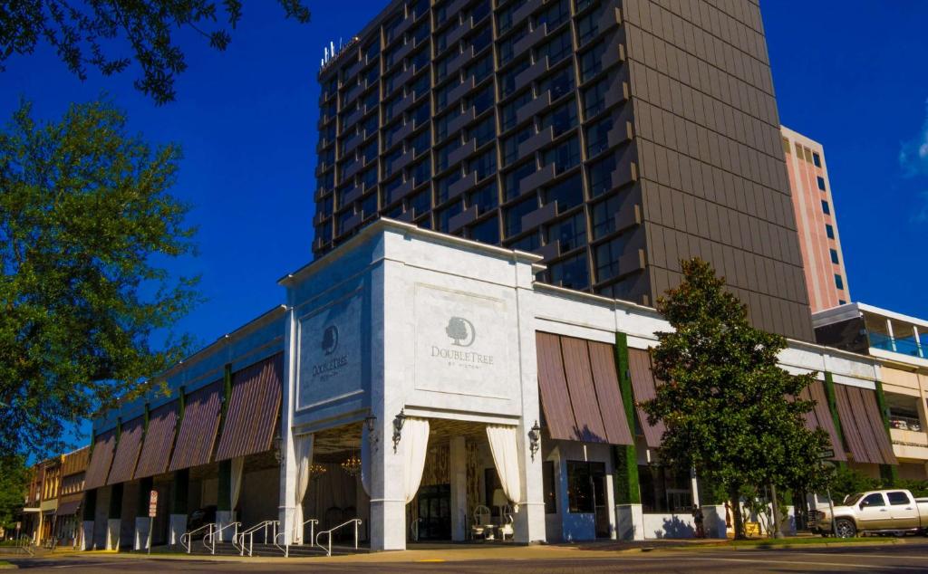 a building in front of a tall building at DoubleTree by Hilton Hotel Tallahassee in Tallahassee