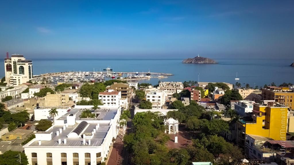 an aerial view of a city and the ocean at Aluna Hostel B&B in Santa Marta