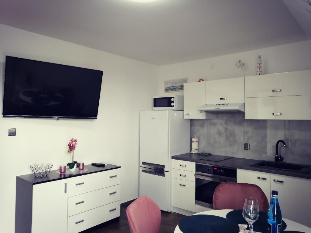 Kuchyň nebo kuchyňský kout v ubytování Apartamenty WIKTORIA morska18