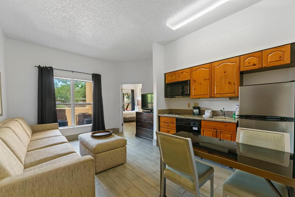 a living room with a couch and a kitchen at Scottsdale upgraded 1 bd 1 ba 2 Queen Beds in Scottsdale