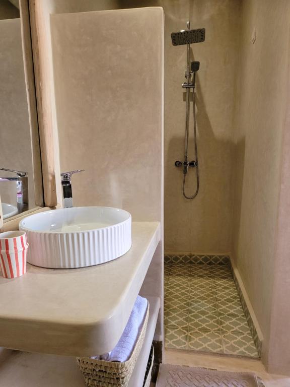 a bathroom with a sink and a shower at Riad Isahiac avec piscine en exclusivité in Marrakech