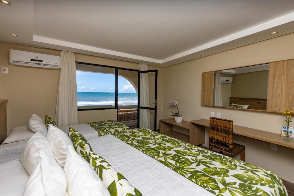 Postel nebo postele na pokoji v ubytování Opaba Praia Hotel