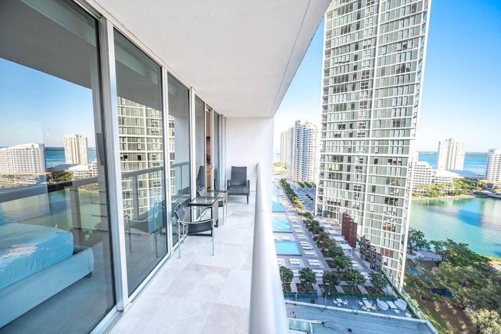 an apartment balcony with a view of a building at ICON & W Hotel Waterfront 22nd Floor Top Spa in Miami