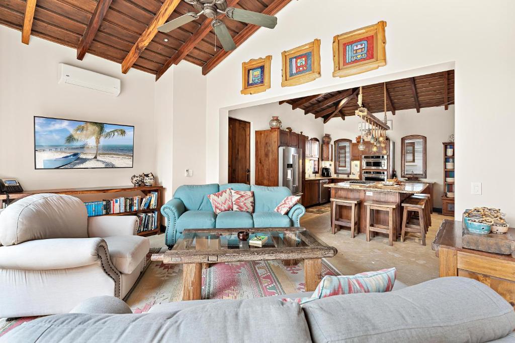 a living room with a couch and a table at Casa Maya in Potrero