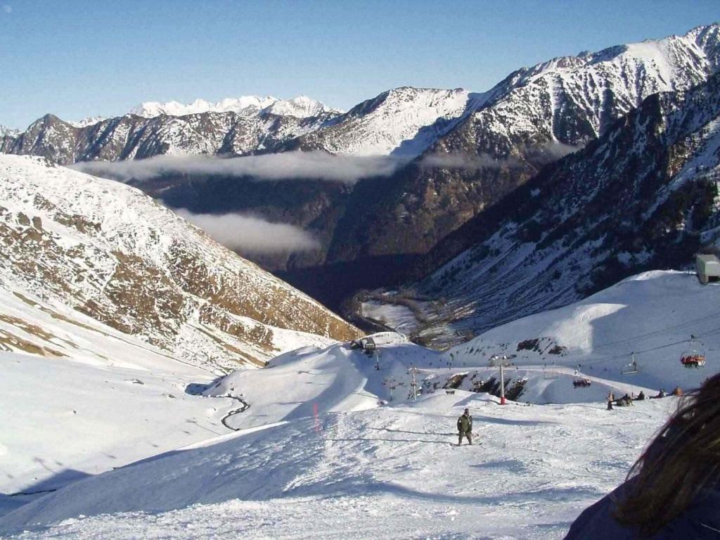 a group of people skiing down a snow covered mountain at Bel appt 3 * plein Centre ville 4 pers. + balcon in Cauterets