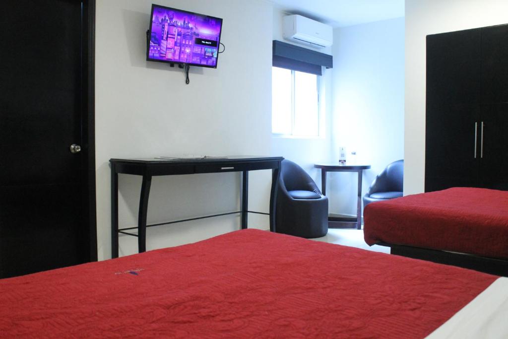 Postel nebo postele na pokoji v ubytování Hotel Velario