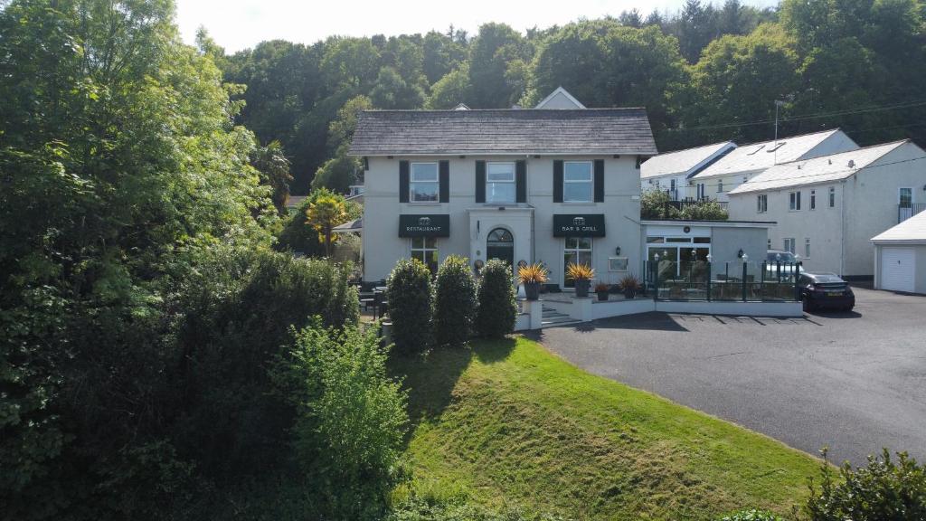 an aerial view of a house with a parking lot at Fernhill Hotel in Lyme Regis