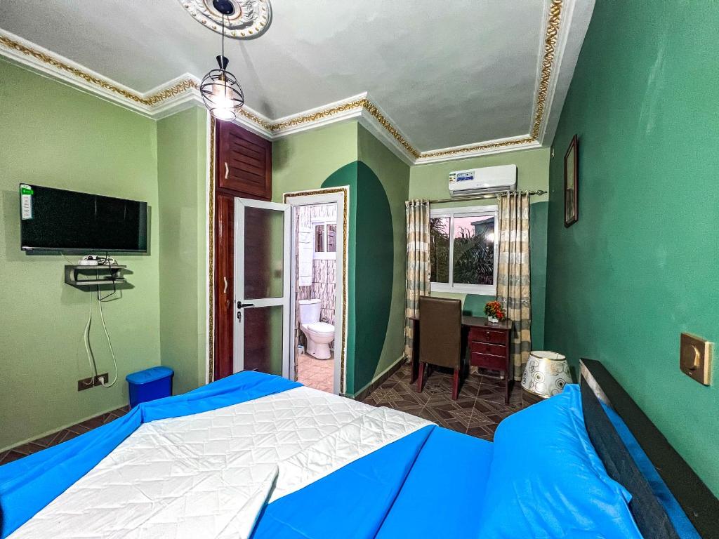 TV a/nebo společenská místnost v ubytování Hôtel The Place
