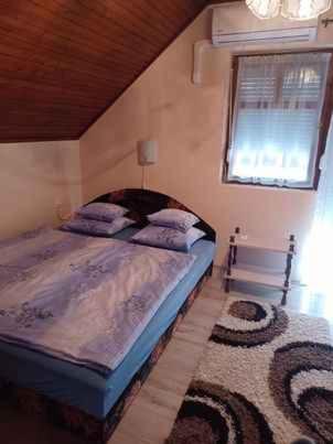 Posteľ alebo postele v izbe v ubytovaní Holiday home Balatonkeresztur 12