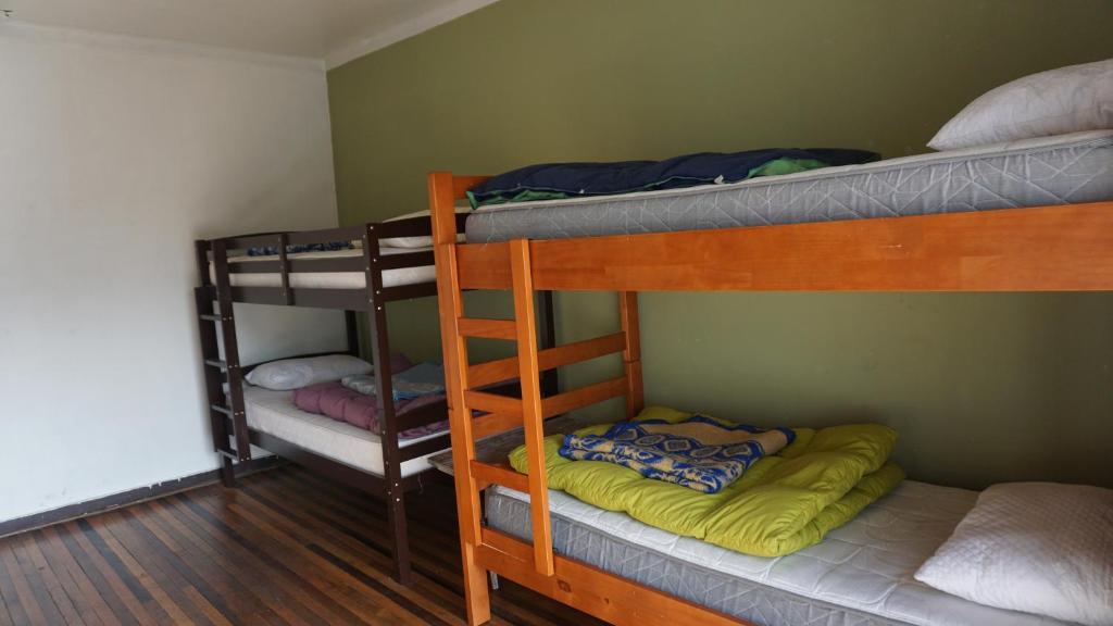 Voodi või voodid majutusasutuse Ventana Sur Hostal toas