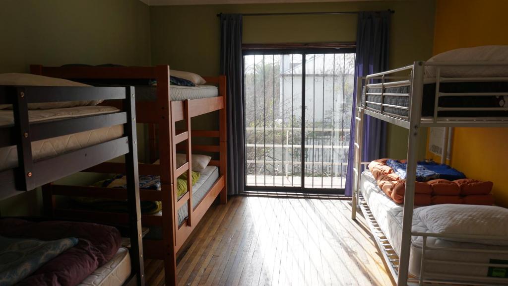 Voodi või voodid majutusasutuse Ventana Sur Hostal toas
