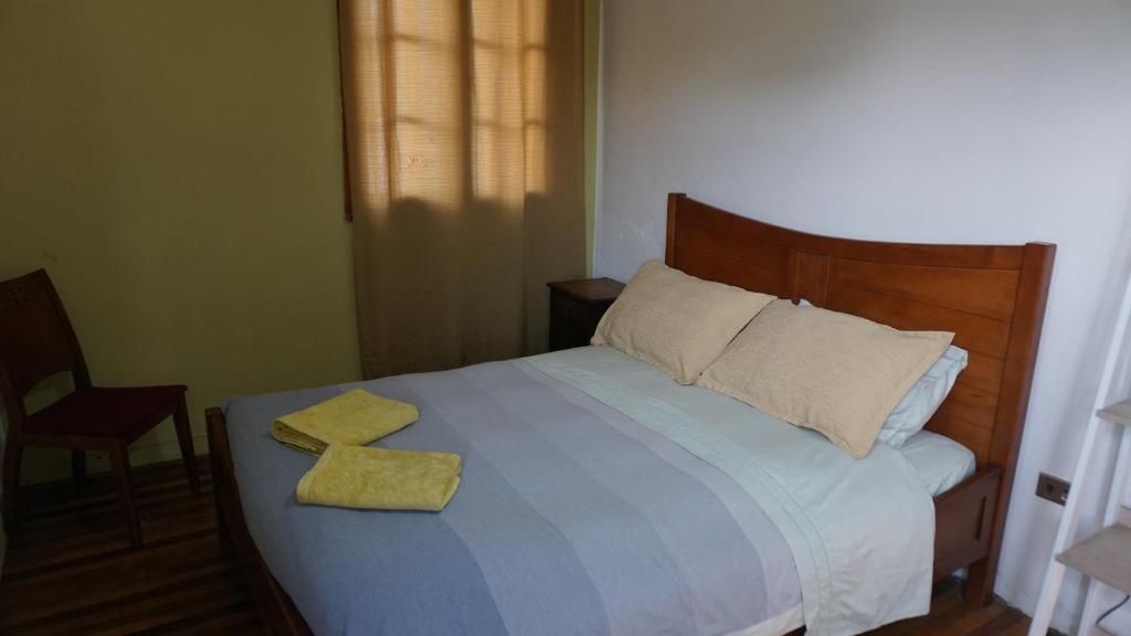 Voodi või voodid majutusasutuse Ventana Sur Hostal toas