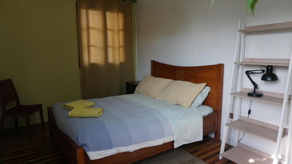 Voodi või voodid majutusasutuse Ventana Sur Hostal toas
