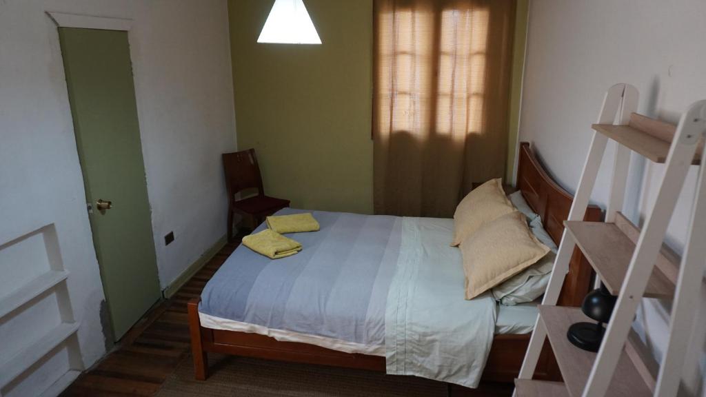 Voodi või voodid majutusasutuse Ventana Sur Hostal toas