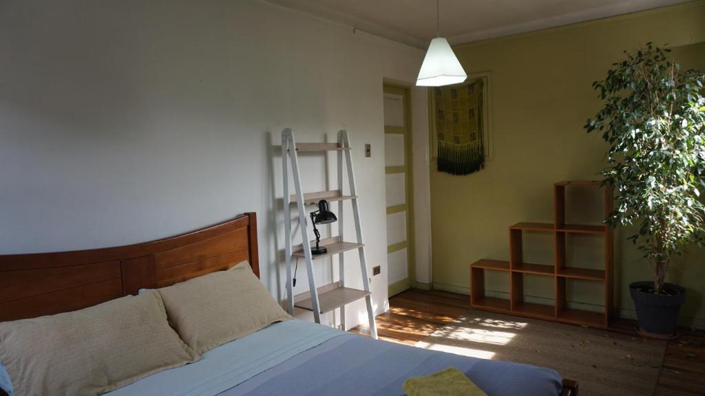 Voodi või voodid majutusasutuse Ventana Sur Hostal toas
