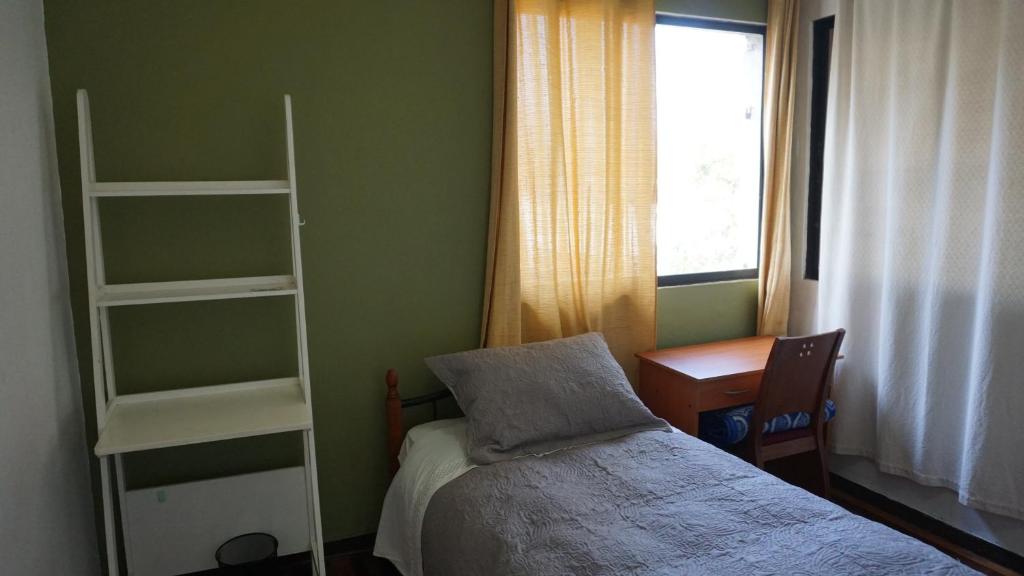 Voodi või voodid majutusasutuse Ventana Sur Hostal toas