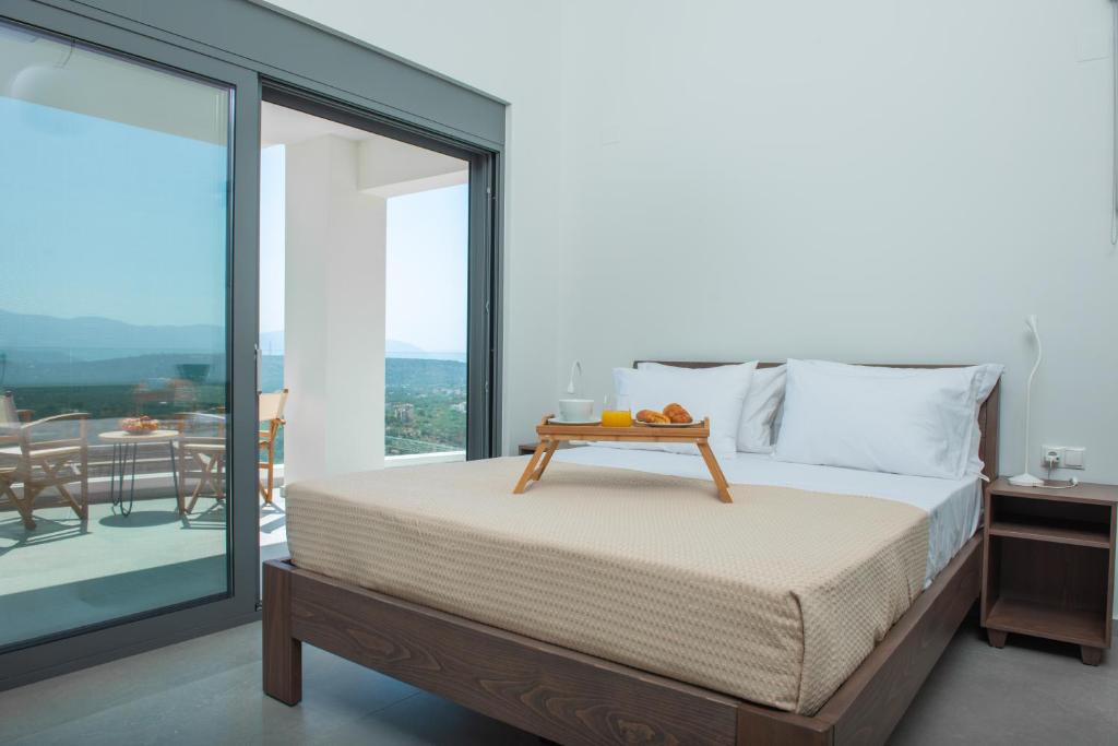 Postel nebo postele na pokoji v ubytování KaDeView Luxury