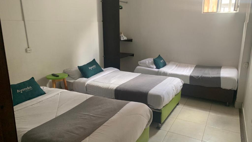 Postel nebo postele na pokoji v ubytování Hotel Quintas de Normandia