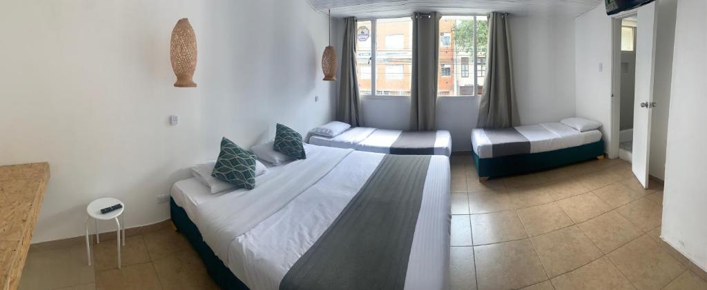Postel nebo postele na pokoji v ubytování Hotel Quintas de Normandia