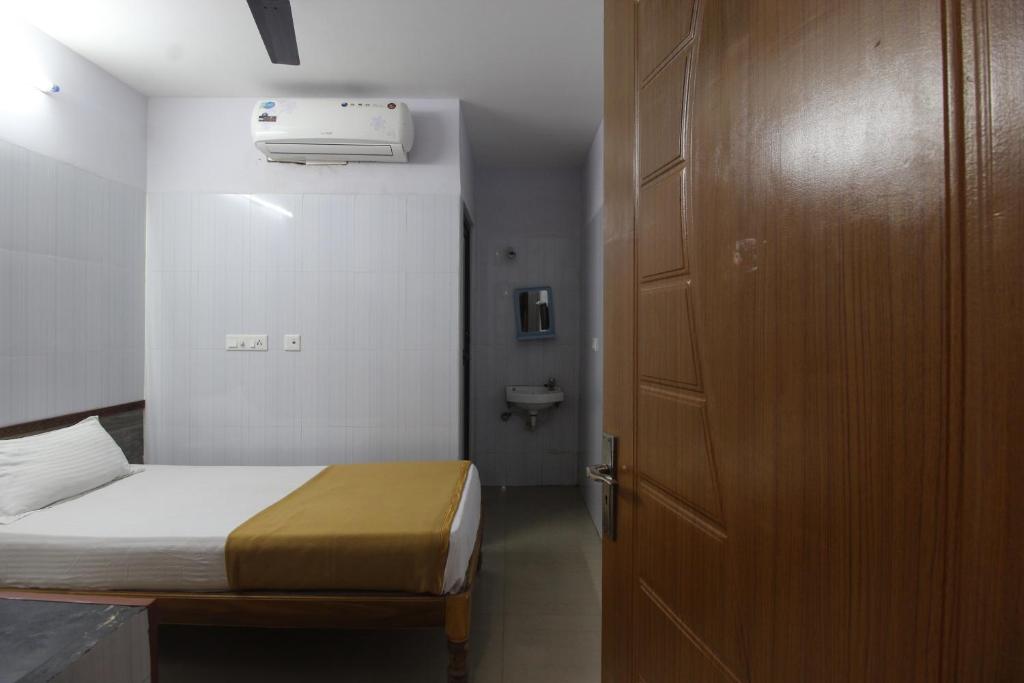 Postel nebo postele na pokoji v ubytování JKS DELUXE LODGE